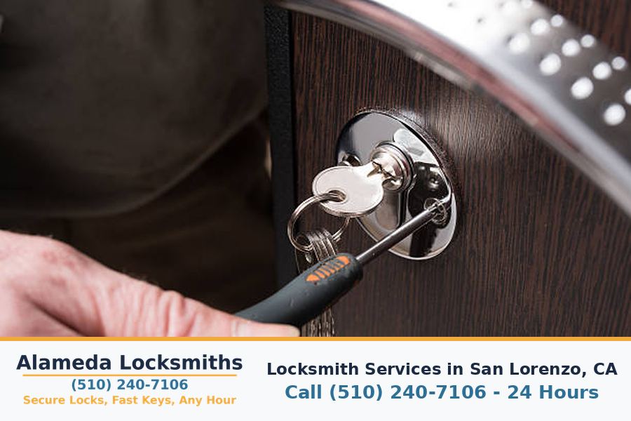 Locksmith working on a residential door lock in San Lorenzo, CA