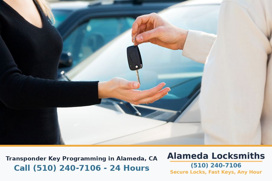 Transponder chip car key being programmed to the vehicle